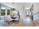 Contemporary dining room with large windows, stylish lighting, and seating for six at 361 Murray Grey Ln, Wake Forest, NC 27587