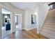Inviting hallway with hardwood floors, staircase and views into multiple rooms at 361 Murray Grey Ln, Wake Forest, NC 27587