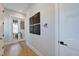 Hallway showcasing modern panel art, and white doors and trim at 361 Murray Grey Ln, Wake Forest, NC 27587