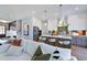 Stylish kitchen view from living area, showcasing stainless steel appliances, island seating, and modern finishes at 361 Murray Grey Ln, Wake Forest, NC 27587