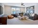 Inviting living room features a comfortable sectional sofa, large window, and unique sports decor at 361 Murray Grey Ln, Wake Forest, NC 27587
