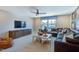 Comfortable living room with a large TV, sectional sofa, and a bright window at 361 Murray Grey Ln, Wake Forest, NC 27587