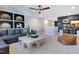 Relaxing living room with sofa, adjacent desk area, and unique decor with natural lighting at 361 Murray Grey Ln, Wake Forest, NC 27587