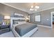 Luxurious main bedroom showcases a plush bed, elegant lighting, and tasteful decor at 361 Murray Grey Ln, Wake Forest, NC 27587