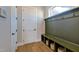 Mudroom featuring a built-in bench with storage and a door at 361 Murray Grey Ln, Wake Forest, NC 27587