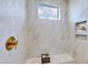 Spa-like shower with marble tile, a built-in bench, and a rain shower head at 361 Murray Grey Ln, Wake Forest, NC 27587