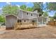 A spacious wooden deck and screened-in porch enhances the backyard of this gray sided two-story home at 3700 Summer Pl, Raleigh, NC 27604