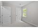 Bedroom features carpet flooring, fresh paint, and natural light through a bright window at 3700 Summer Pl, Raleigh, NC 27604