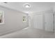 Bedroom features soft carpet flooring, closets, fresh paint, and natural light from two windows at 3700 Summer Pl, Raleigh, NC 27604