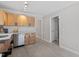 Bright kitchen showcasing stainless steel appliances, sleek countertops, and wood cabinetry at 3700 Summer Pl, Raleigh, NC 27604