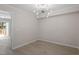 Bright and airy room with hardwood floors and a modern chandelier, perfect for dining or entertaining at 3700 Summer Pl, Raleigh, NC 27604