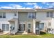 The back of this townhome has a sliding glass door, patio and a lawn at 3806 Bison Hill Ln, Raleigh, NC 27604