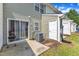 Backyard patio area with grill, a/c unit, exterior door, and sliding glass door at 3806 Bison Hill Ln, Raleigh, NC 27604