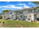 Exterior back of home with concrete patio, sliding glass door and small yard at 3806 Bison Hill Ln, Raleigh, NC 27604