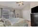 Bright bedroom with a TV, a window with plenty of sunlight, and ample closet space at 3806 Bison Hill Ln, Raleigh, NC 27604