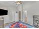 Cozy bedroom, with mounted television, showcasing a double door closet and an ensuite bathroom at 3806 Bison Hill Ln, Raleigh, NC 27604