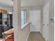 View of entryway with tile floor, coat closet, and access to kitchen at 3806 Bison Hill Ln, Raleigh, NC 27604