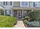 Welcoming entrance of the townhome featuring a stone facade and neat landscaping at 3806 Bison Hill Ln, Raleigh, NC 27604