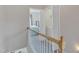 Upstairs hallway with access to the bedroom and laundry room, offering a convenient layout at 3806 Bison Hill Ln, Raleigh, NC 27604