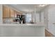 Well-lit kitchen featuring wood cabinets, modern appliances, and a breakfast bar overlooking an adjacent dining area at 3806 Bison Hill Ln, Raleigh, NC 27604