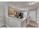 Spacious kitchen with bar area and view of the front door and living area at 3806 Bison Hill Ln, Raleigh, NC 27604