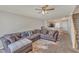 Spacious living room showcasing the kitchen area with a generous sofa and a view into other rooms at 3806 Bison Hill Ln, Raleigh, NC 27604