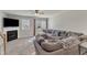 Cozy living room with a fireplace, a large sectional sofa, and natural light, perfect for relaxation and gatherings at 3806 Bison Hill Ln, Raleigh, NC 27604