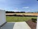Landscaped backyard with partially fenced yard and grass at 381 Thompson Overlook Way, Smithfield, NC 27577
