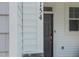 Inviting front door, with black hardware, provides secure access and visual appeal at 381 Thompson Overlook Way, Smithfield, NC 27577