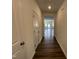 Inviting hallway with hardwood floors leads to the main living space at 381 Thompson Overlook Way, Smithfield, NC 27577