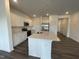 Modern kitchen with stainless steel appliances and white cabinets at 381 Thompson Overlook Way, Smithfield, NC 27577