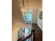 Staircase with hardwood floors, neutral walls, and a decorative chandelier at 404 Versailles Dr, Cary, NC 27511