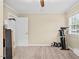 Spacious bedroom with carpet floors and exercise equipment at 4048 B S Nc 62 Hwy, Burlington, NC 27215