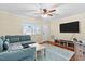 Bright living room featuring hardwood floors, modern decor, and a comfortable seating area at 4048 B S Nc 62 Hwy, Burlington, NC 27215