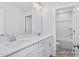 Bathroom featuring a double vanity with quartz countertop and tile flooring at 436 Longleaf Glen Lane, Zebulon, NC 27597