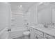 Clean white bathroom featuring a tub and shower combo, toilet, and a vanity with a sink at 436 Longleaf Glen Lane, Zebulon, NC 27597