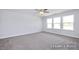 Bedroom featuring carpet flooring, a ceiling fan, and large windows at 436 Longleaf Glen Lane, Zebulon, NC 27597