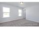 Bedroom featuring carpet flooring, windows, and natural light at 436 Longleaf Glen Lane, Zebulon, NC 27597