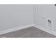 Laundry room with white trim and gray vinyl flooring at 436 Longleaf Glen Lane, Zebulon, NC 27597