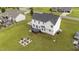 Aerial view of the home featuring a large backyard, deck, and patio at 46 Blaze Ridge Dr, Smithfield, NC 27577
