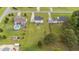 Property aerial view showing a huge backyard with multiple structures and landscaping at 46 Blaze Ridge Dr, Smithfield, NC 27577