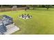 Large backyard shows the deck and stone patio seating area surrounding a fire pit at 46 Blaze Ridge Dr, Smithfield, NC 27577