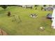 Expansive backyard features a swing set, outdoor seating area, and mature landscaping at 46 Blaze Ridge Dr, Smithfield, NC 27577
