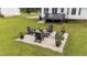 Outdoor patio boasts a cozy fire pit and seating area, perfect for entertaining guests at 46 Blaze Ridge Dr, Smithfield, NC 27577