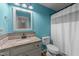 Bathroom featuring granite countertops, blue painted walls, and a shower with a white shower curtain at 46 Blaze Ridge Dr, Smithfield, NC 27577