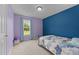 This bedroom has two-tone paint in blue and purple, a star ceiling, and a window at 46 Blaze Ridge Dr, Smithfield, NC 27577