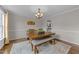 Bright dining room featuring hardwood floors, modern chandelier and neutral decor at 46 Blaze Ridge Dr, Smithfield, NC 27577