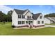 Classic two-story home with white siding, black shutters, and manicured front lawn at 46 Blaze Ridge Dr, Smithfield, NC 27577