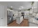 Bright kitchen with stainless steel appliances, granite countertops and white cabinets at 46 Blaze Ridge Dr, Smithfield, NC 27577