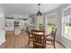 Eat-in kitchen with stainless steel appliances, wood floors, and ample windows at 46 Blaze Ridge Dr, Smithfield, NC 27577